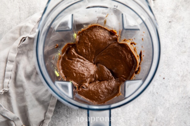 Overhead view of avocado chocolate mousse in a blender.
