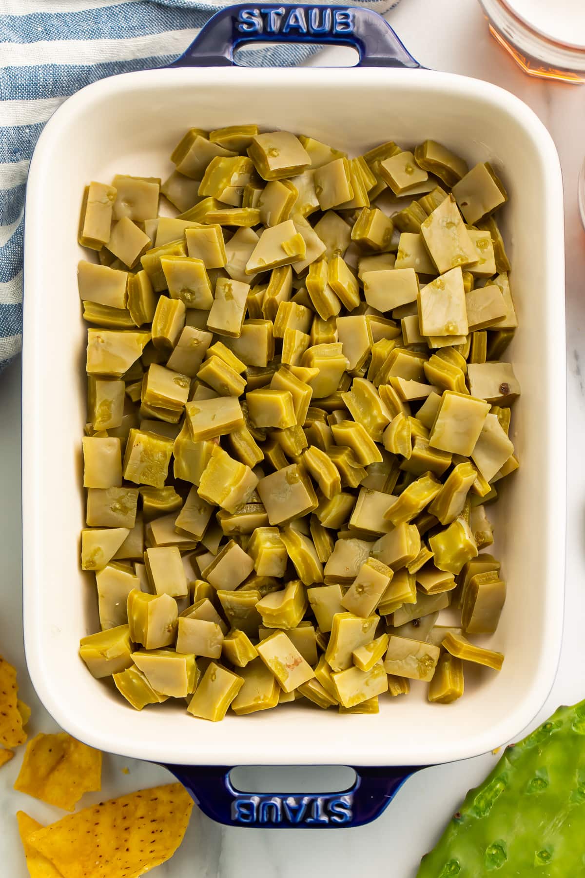 Top-down photo of a casserole dish filled with diced nopales.