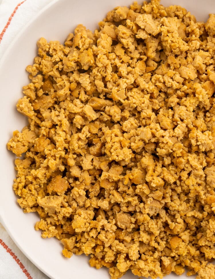 A bowl of crumbled ground beef made from seitan.