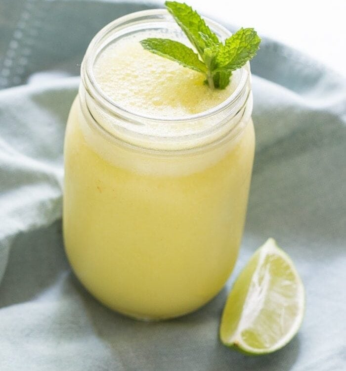 Mango mojito smoothie. Literally, summer in a glass. Creamy, frothy, sweet, fresh.. just perfect.