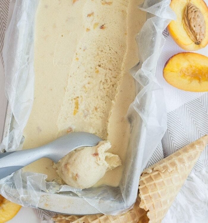 Vegan Peach Ice Cream. 7 ingredients, no refined sugars, no gluten. Just tons of peaches and coconut milk and summery goodness!