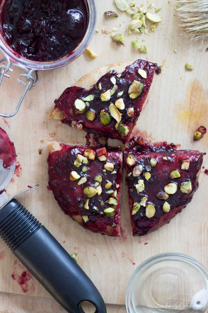 Breakfast Pizza (vegan). Whole wheat pita, salty pistachios, and fruity, gooey jam. So versatile and perfectly satisfying in the morning!