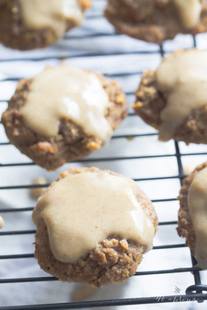 Pumpkin cookies with a maple glaze. These are so insanely healthy but so rich and indulgent! Vegan, gluten free, refined sugar free. They're basically rehab for your seasonal indulgences..