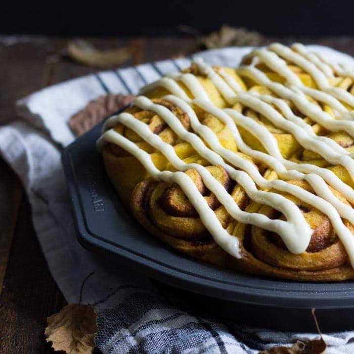 Vegan pumpkin cinnamon rolls with a maple-cream cheese glaze - simplified and ready in about 2 hours, these are the perfect fall breakfast