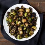 Crispy miso roasted brussel sprouts - in a miso, white wine, and butter sauce, these brussel sprouts are crazy good and so simple! Perfect for Thanksgiving
