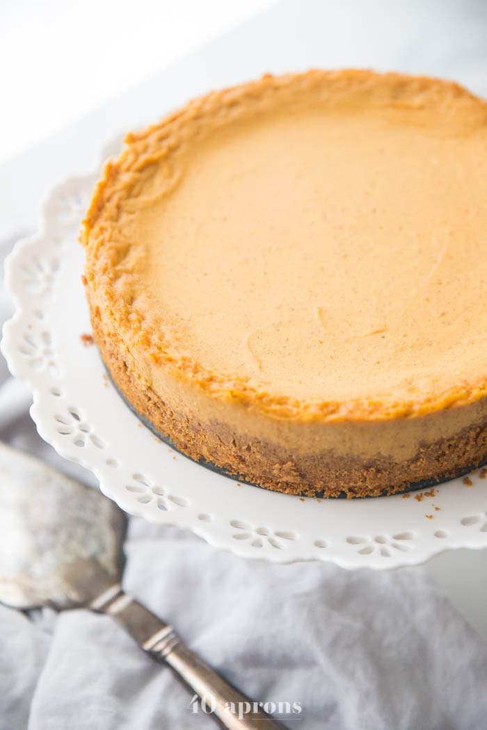 Vegan pumpkin cheesecake on a cake stand