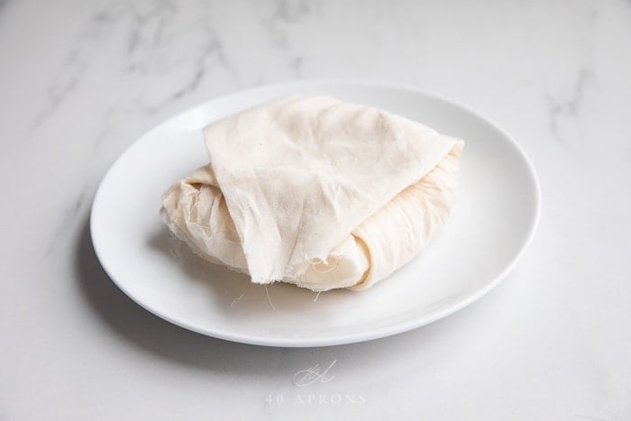 Paneer wrapped in cheesecloth
