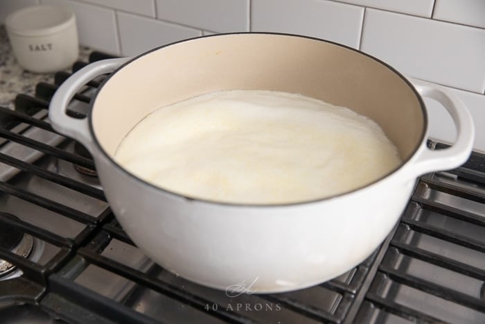 Pot of foamy almost boiling milk