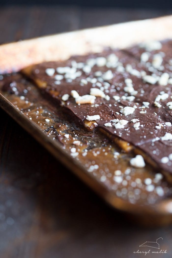 The perfect last-minute holiday gift! Saltine toffee: crunchy, salty saltines covered in buttery caramel and slathered in rich dark chocolate. 