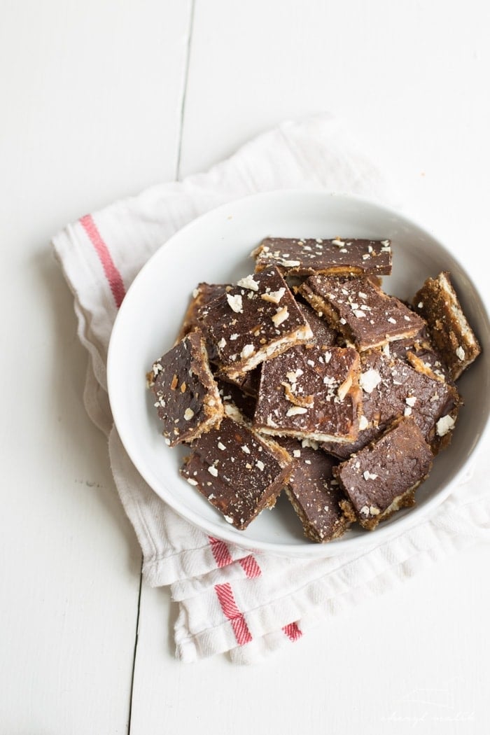 The perfect last-minute holiday gift! Saltine toffee: crunchy, salty saltines covered in buttery caramel and slathered in rich dark chocolate. 