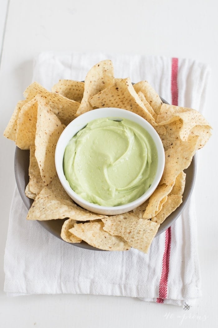 A tart, rich, and bright avocado dip that takes minutes to prepare and is incredibly versatile. Greek yogurt for protein and general ease and deliciousness! // 40 Aprons