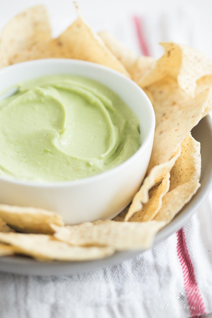A tart, rich, and bright avocado dip that takes minutes to prepare and is incredibly versatile. Greek yogurt for protein and general ease and deliciousness! // 40 Aprons