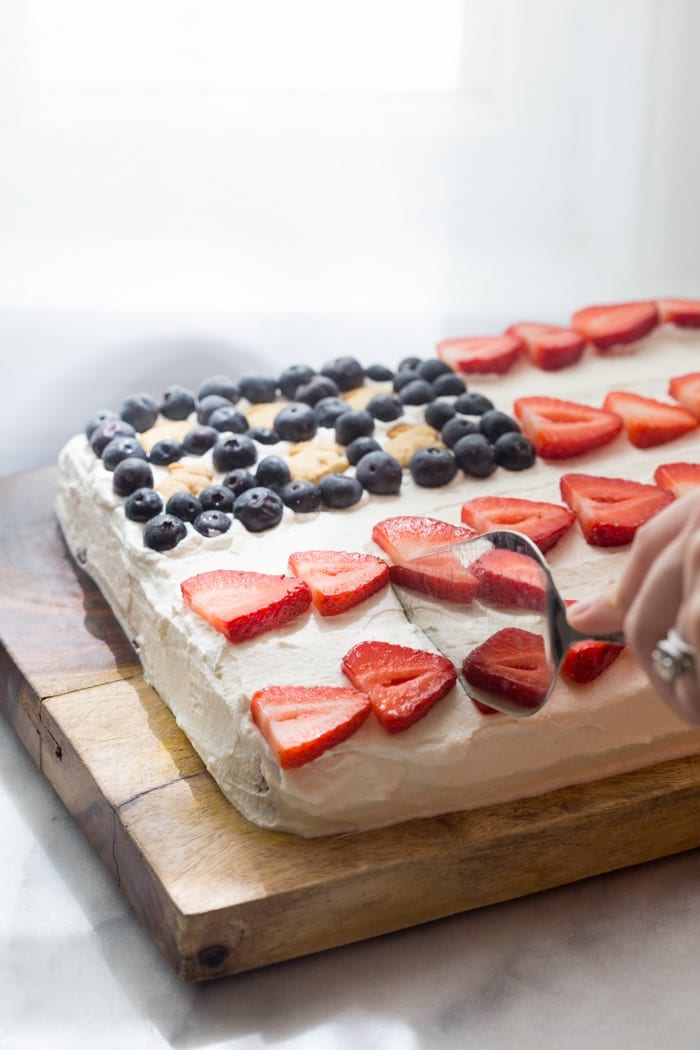 Flag Cake with Whipped Cream Frosting & Bunny Grahams // Rich yellow cake with a whipped cream-cream cheese frosting, finished with fresh fruit and sweet Bunny Grahams. Happy 4th of July, you beautiful patriot, you.