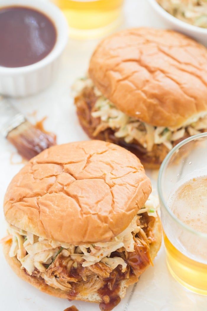 Crockpot BBQ Chicken Sandwiches - easy and perfectly tender, flavorful, and smoky, these are new standbys in our meal plan! // 40 Aprons