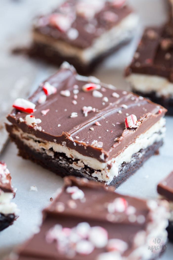 Peppermint layer brownies. Unbelievable peppermint chocolate layered brownies: tender brownie, creamy cool frosting, and rich pepperminty ganache. Oh. My. Heavens. // 40 Aprons