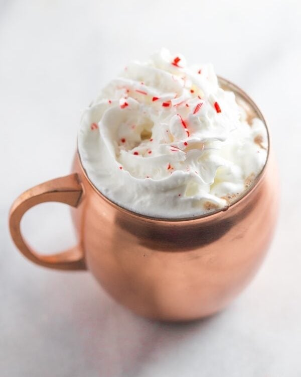 Spiked peppermint hot chocolate. So rich and creamy with the perfect peppermint kick.. truly a merry Christmas! // 40 Aprons