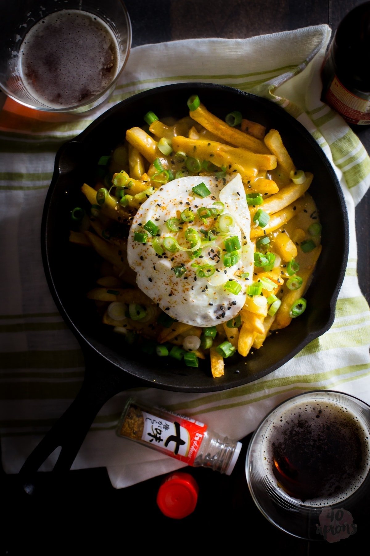 Japanese curry fries. Definition of epic. Rich, spiced Japanese curry sauce smothers crispy fries, topped with an egg over easy. Mama. // 40 Aprons