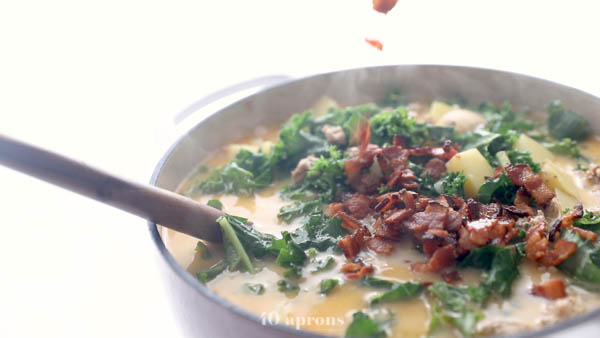 Add kale, sausage, bacon, and coconut milk