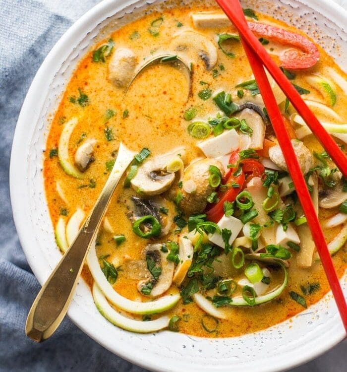 This paleo coconut curry zoodle soup is quick and delicious, loaded with creamy coconut milk, intensely flavorful red curry paste, and zoodles. This recipe is a wonderful paleo dinner or paleo soup recipe to add to your collection. Low carb yet filling, you can make this paleo coconut curry zoodle soup a vegan coconut curry zoodle soup with an easy swap!