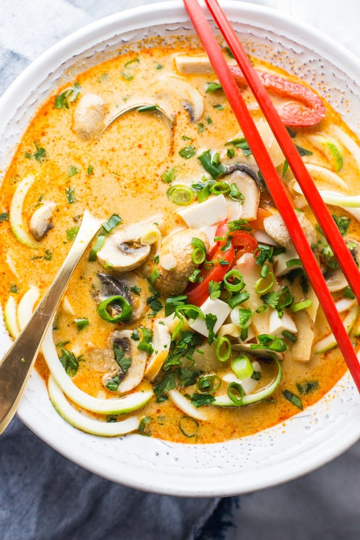 This paleo coconut curry zoodle soup is quick and delicious, loaded with creamy coconut milk, intensely flavorful red curry paste, and zoodles. This recipe is a wonderful paleo dinner or paleo soup recipe to add to your collection. Low carb yet filling, you can make this paleo coconut curry zoodle soup a vegan coconut curry zoodle soup with an easy swap! 