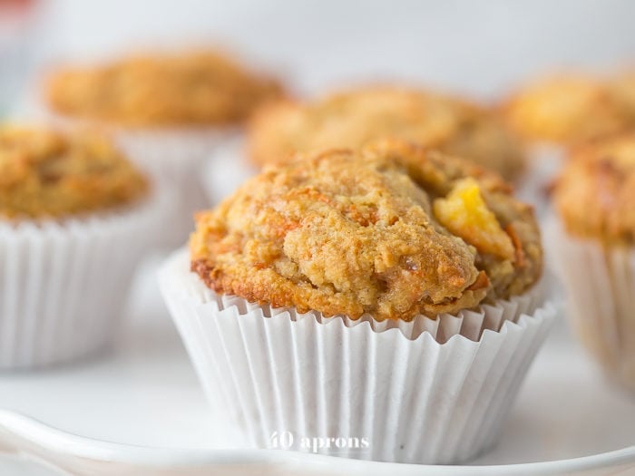 These peach ginger paleo muffins are moist and tender, full of fruity, fresh peaches and earthy ginger. The best thing about these paleo muffins? They don't taste like they're paleo! Grain-free, gluten-free, and refined sugar-free, these make an awesome paleo breakfast, too.