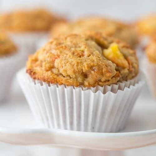 These peach ginger paleo muffins are moist and tender, full of fruity, fresh peaches and earthy ginger. The best thing about these paleo muffins? They don't taste like they're paleo! Grain-free, gluten-free, and refined sugar-free, these make an awesome paleo breakfast, too.