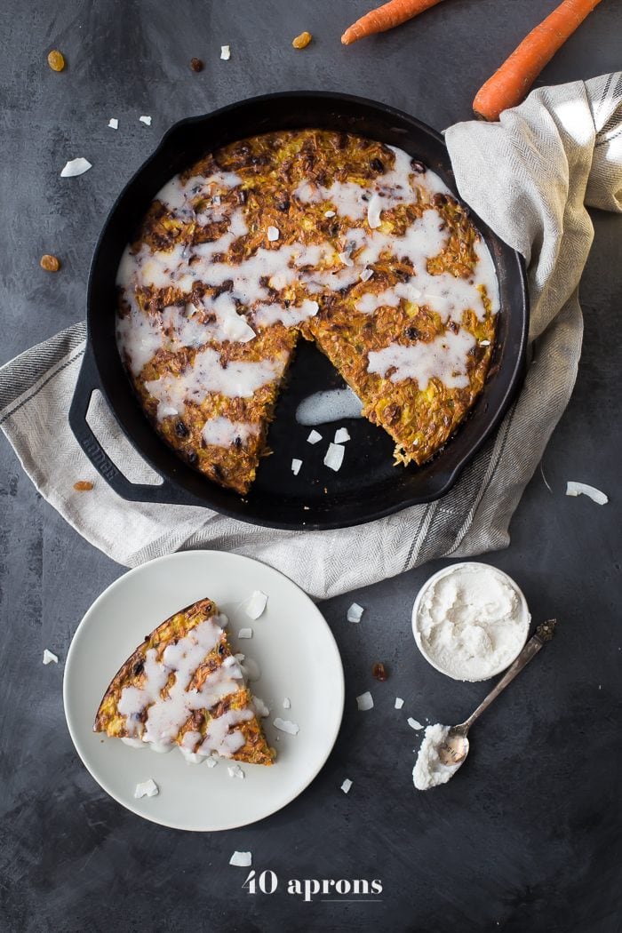This carrot cake paleo breakfast bake is like eating carrot cake for breakfast! With pineapple, golden raisins, coconut, cinnamon, walnuts, and a paleo cream cheese glaze, this paleo breakfast bake is easy but delicious. Destined to become a regular on your paleo breakfast bake roster!