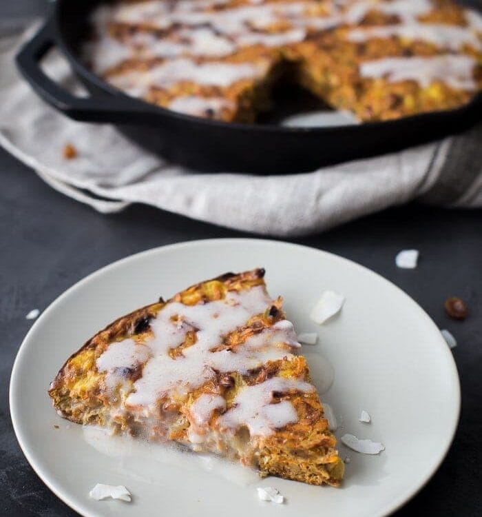 This carrot cake paleo breakfast bake is like eating carrot cake for breakfast! With pineapple, golden raisins, coconut, cinnamon, walnuts, and a paleo cream cheese glaze, this paleo breakfast bake is easy but delicious. Destined to become a regular on your paleo breakfast bake roster!