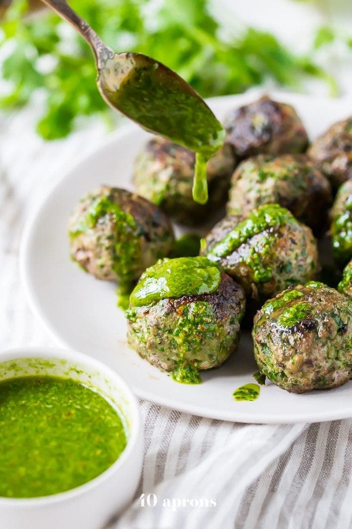 These chimichurri Whole30 meatballs are packed full of flavor and come together easily with the help of a food processor. Ideal for those on a spring or summer Whole30, they’re garlicky and tender, thanks to the Swiss chard. Is there any better way to get your greens?