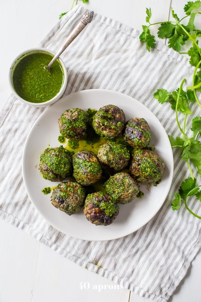 These chimichurri Whole30 meatballs are packed full of flavor and come together easily with the help of a food processor. Ideal for those on a spring or summer Whole30, they’re garlicky and tender, thanks to the Swiss chard. Is there any better way to get your greens?