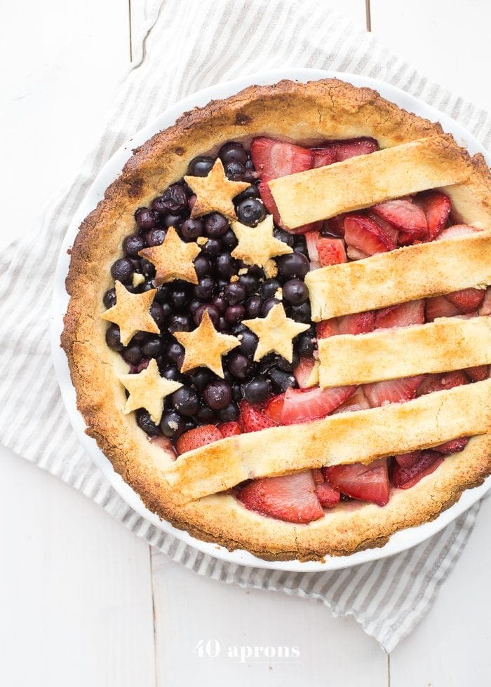 This paleo American flag pie is the absolute perfect paleo 4th of July dessert. Full of fresh strawberries and blueberries with a crunchy crust, it's a stellar paleo pie that's just stunning. Is there a better paleo pie for the ultimate paleo 4th of July dessert table? I think not!