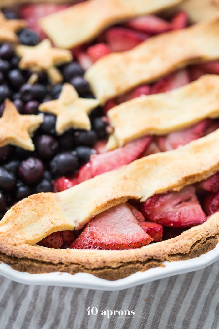 This paleo American flag pie is the absolute perfect paleo 4th of July dessert. Full of fresh strawberries and blueberries with a crunchy crust, it's a stellar paleo pie that's just stunning. Is there a better paleo pie for the ultimate paleo 4th of July dessert table? I think not!