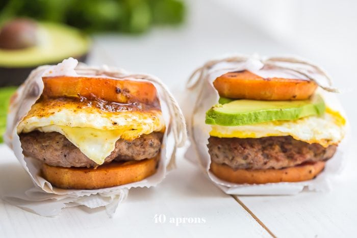 These Whole30 breakfast sandwiches are easy to make and insanely good. Buttery sweet potato buns layered with Whole30 breakfast sausage, fried egg, and avocado or quick Whole30 chipotle aioli, they're about to be your favorite Whole30 breakfast.