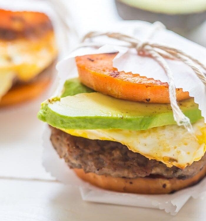 These Whole30 breakfast sandwiches are easy to make and insanely good. Buttery sweet potato buns layered with Whole30 breakfast sausage, fried egg, and avocado or quick Whole30 chipotle aioli, they're about to be your favorite Whole30 breakfast.