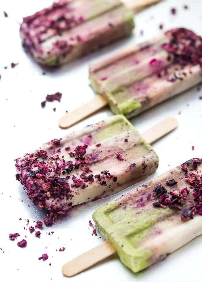 These mermaid popsicles layer a creamy coconut matcha mixture with a sweet coconut cream and honey roasted blackberries. Perfect for a mermaid party or mermaid birthday party, these stunning paleo popsicles are surprisingly easy. One of my favorite paleo popsicle recipes or vegan popsicle recipes, these mermaid popsicles are just too much fun! Made with the best popsicle mold and my favorite matcha powder.