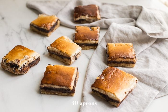 These paleo smores bars are the perfect paleo dessert this summer. A graham cracker crust, topped with chocolate and a burnt marshmallow layer, they're inspired by the classic summer treat but are grain-free, dairy-free, and refined-sugar-free. These paleo smores bars are great for entertaining!These paleo smores bars are the perfect paleo dessert this summer. A graham cracker crust, topped with chocolate and a burnt marshmallow layer, they're inspired by the classic summer treat but are grain-free, dairy-free, and refined-sugar-free. These paleo smores bars are great for entertaining!