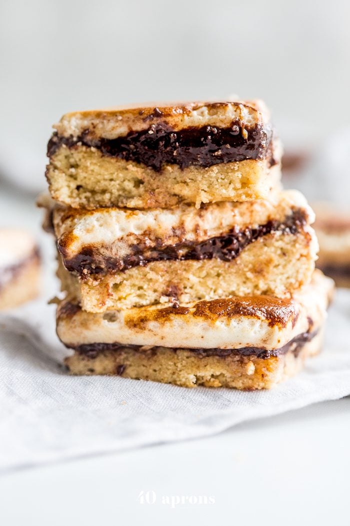 These paleo smores bars are the perfect paleo dessert this summer. A graham cracker crust, topped with chocolate and a burnt marshmallow layer, they're inspired by the classic summer treat but are grain-free, dairy-free, and refined-sugar-free. These paleo smores bars are great for entertaining!