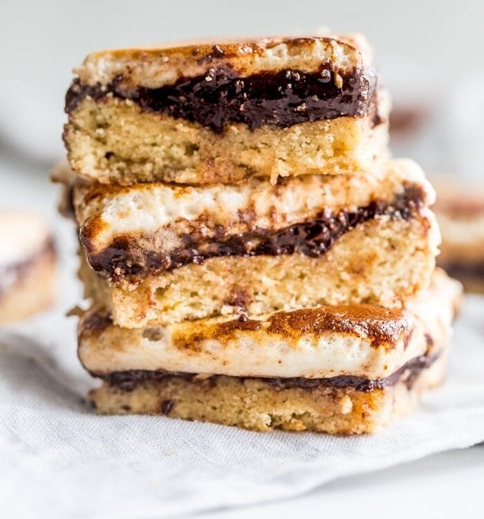 These paleo s'mores bars are the perfect paleo dessert this summer. A graham cracker crust, topped with chocolate and a burnt marshmallow layer, they're inspired by the classic summer treat but are grain-free, dairy-free, and refined-sugar-free. These paleo s'mores bars are great for entertaining!