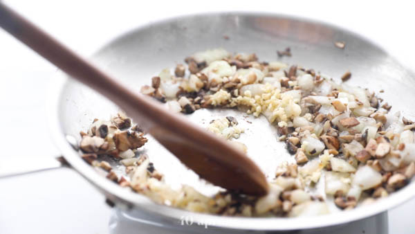 Sauté onion and diced mushrooms until soft