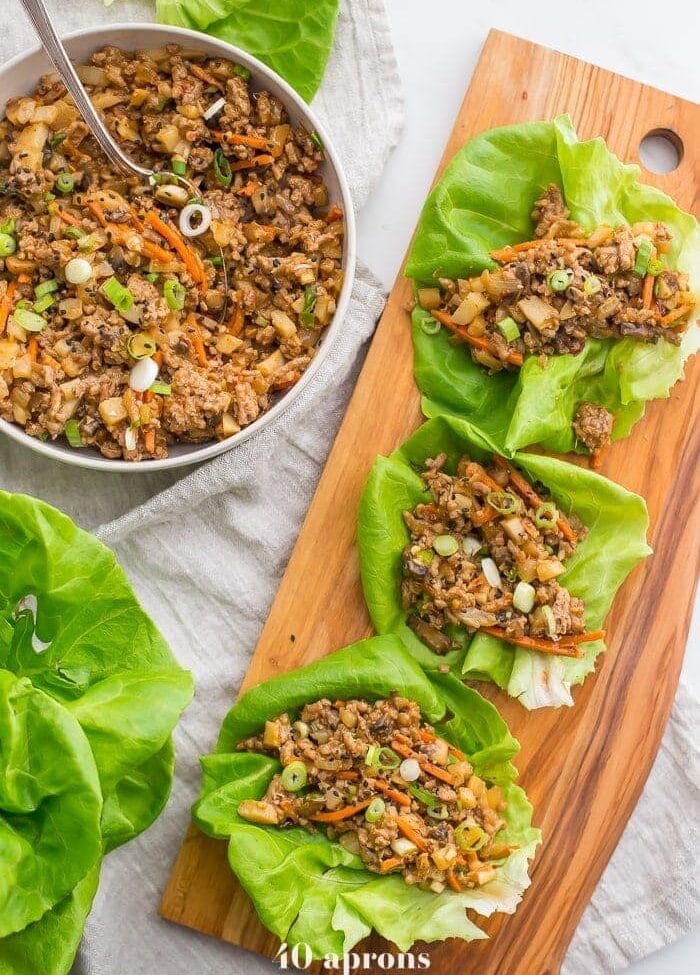 These Whole30 lettuce wraps are the best PF Changs lettuce wraps recipe. Loaded with flavor and with lots of veggies, these Whole30 lettuce wraps are a great Whole30 dinner recipe. You'll love these paleo lettuce wraps because they're filling yet light, totally healthy, and slightly sweet yet nutty and spicy. So good! My favorite PF Changs lettuce wraps recipe, for sure.