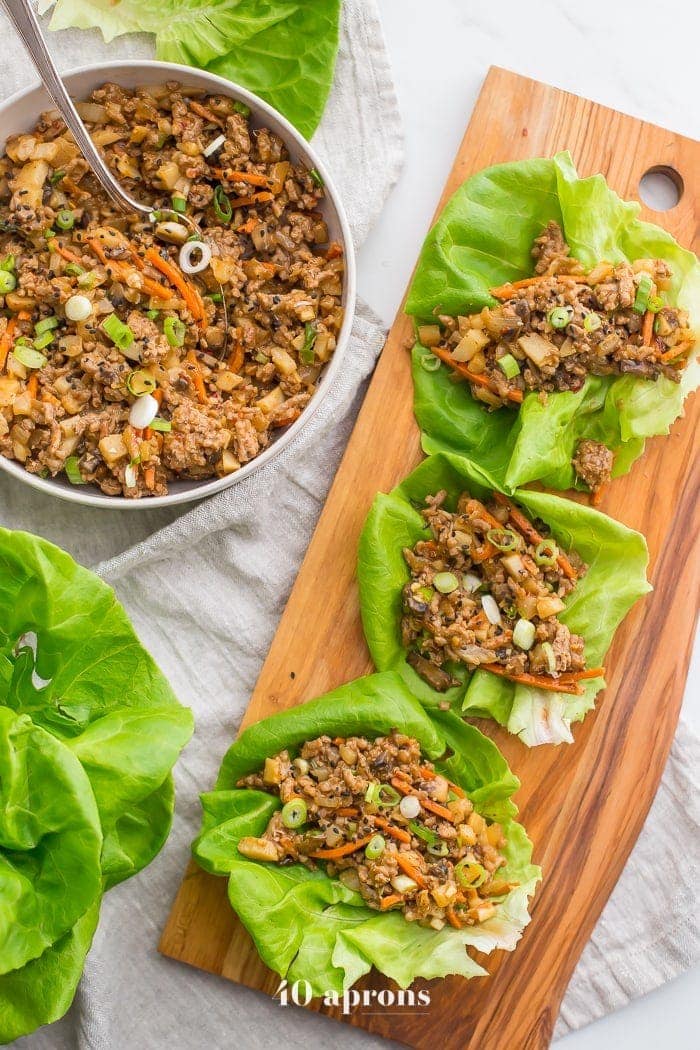 These Whole30 lettuce wraps are the best PF Changs lettuce wraps recipe. Loaded with flavor and with lots of veggies, these Whole30 lettuce wraps are a great Whole30 dinner recipe. You'll love these paleo lettuce wraps because they're filling yet light, totally healthy, and slightly sweet yet nutty and spicy. So good! My favorite PF Changs lettuce wraps recipe, for sure.