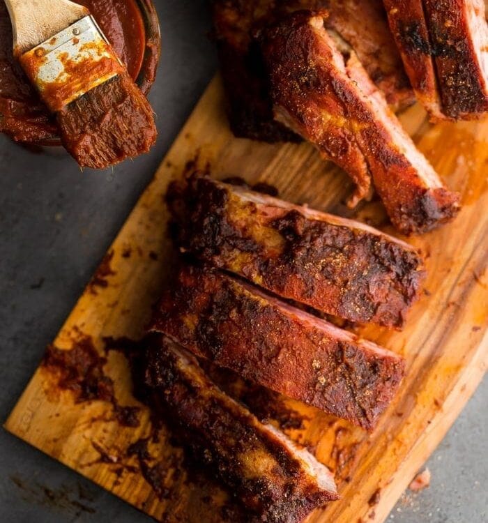 These Whole30 ribs are easy and cooked on the grill, making them a great Whole30 dinner! Smoky, spicy, and full of flavor, they're delicious with my Whole30 BBQ sauce. Definitely the perfect Whole30 ribs or Whole30 dinner now that football season is upon us!