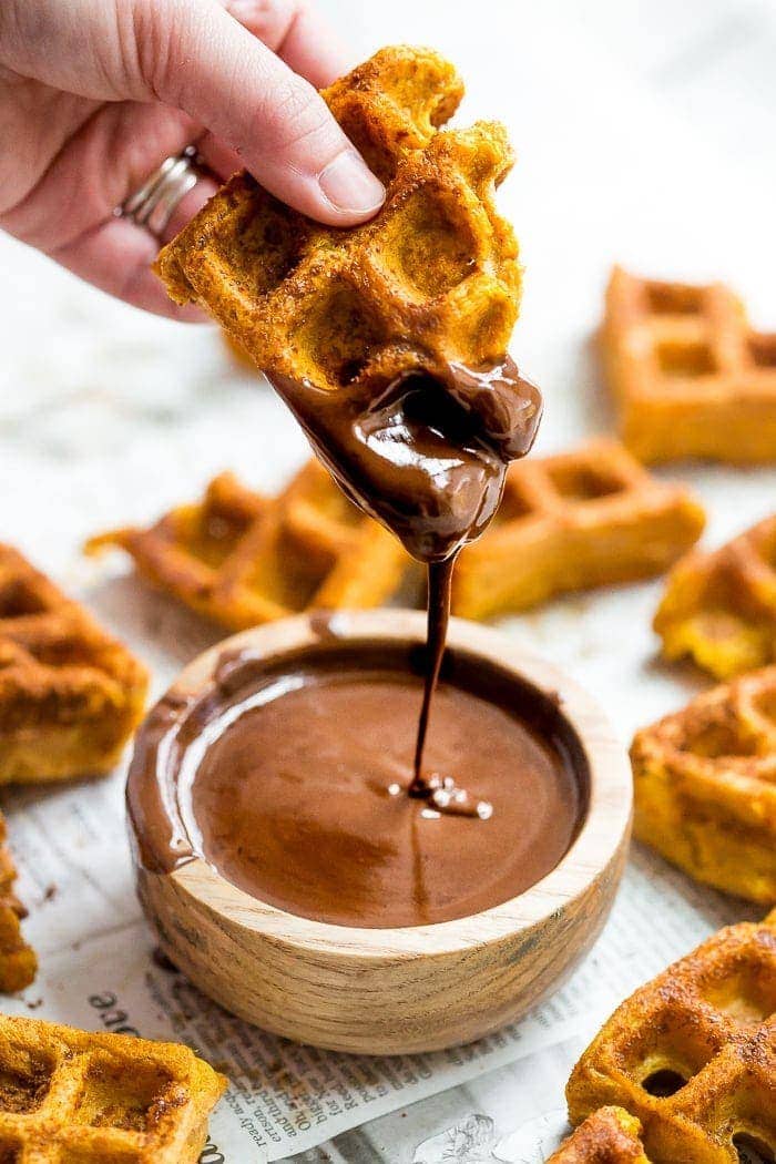 These paleo pumpkin churros with dark chocolate sauce are heavenly: loaded with fall flavor, crispy on the outside, tender on the inside, and made in the waffle iron! They're such a perfect paleo fall recipe because they're totally delicious but there's no frying necessary. These paleo pumpkin churros with dark chocolate sauce are a must make when it comes to paleo fall recipes!