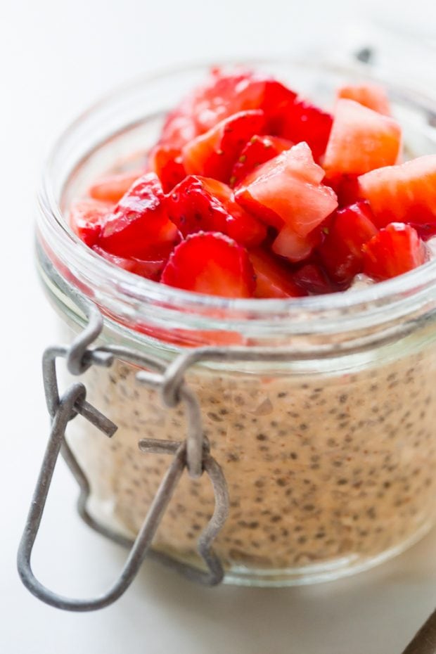 a jar of protein-rich chia pudding topped with strawberries