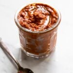 homemade harissa spice paste in a small glass jar