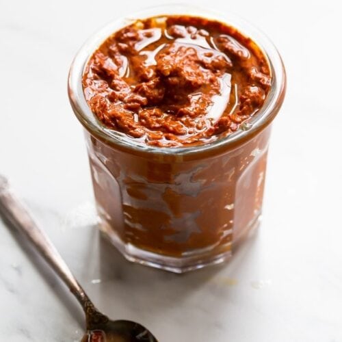 homemade harissa spice paste in a small glass jar