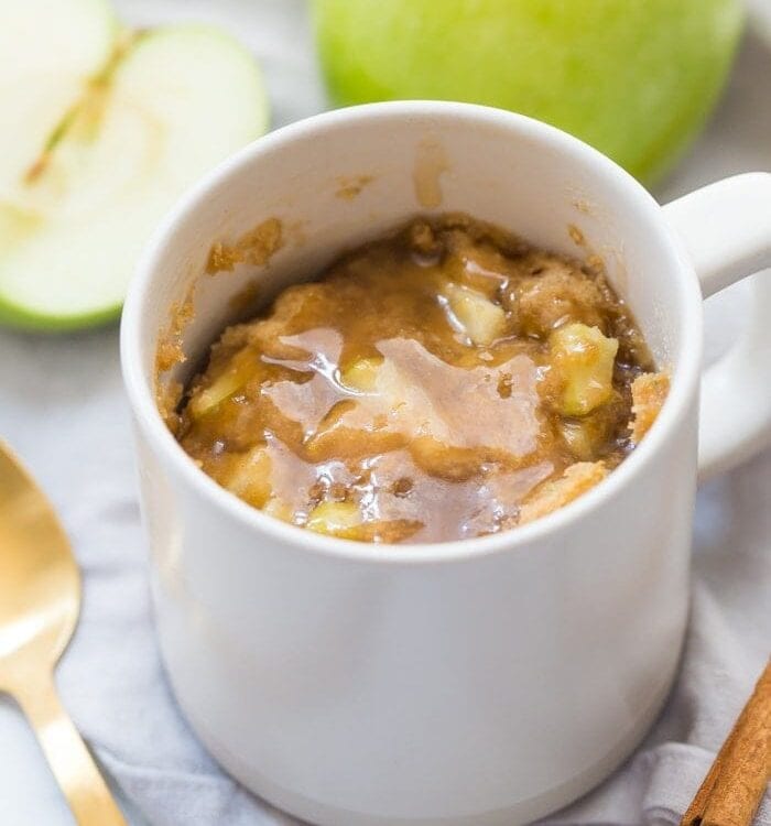 This paleo caramel apple microwave cake is inexplicably good, with a moist cinnamon-spiced cake, tender green apples, and a 2-minute caramel sauce to top it all. I bet you'll make this paleo caramel apple microwave cake all the time, since it only take a few minutes to stir together and two minutes in the microwave to cook! This paleo caramel apple microwave cake is the perfect paleo microwave dessert. I'm obsessed!