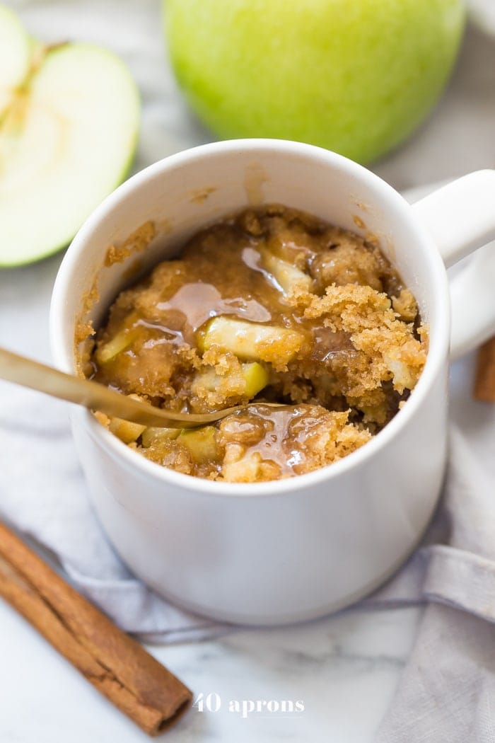 This paleo caramel apple microwave cake is indescribably good, with a moist cinnamon-spiced cake, tender green apples, and a 2-minute caramel sauce to top it all. I bet you'll make this paleo caramel apple microwave cake all the time, since it only take a few minutes to stir together and two minutes in the microwave to cook! This paleo caramel apple microwave cake is the perfect paleo microwave dessert. I'm obsessed!