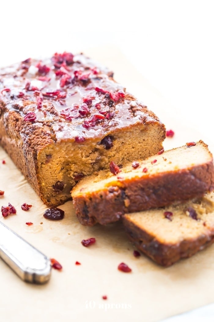 This paleo cranberry orange pound cake is such a wonderful paleo fall recipe! With fresh orange flavor and sweet-tart dried cranberries, this paleo cranberry orange pound cake is tender, moist, and full of flavor. This paleo cranberry orange pound cake takes full advantage of such a fantastic flavor combo and uses all healthier ingredients to make a lovely paleo fall recipe! Plus, details on how to put together the best pregnancy care package (not for me!). 