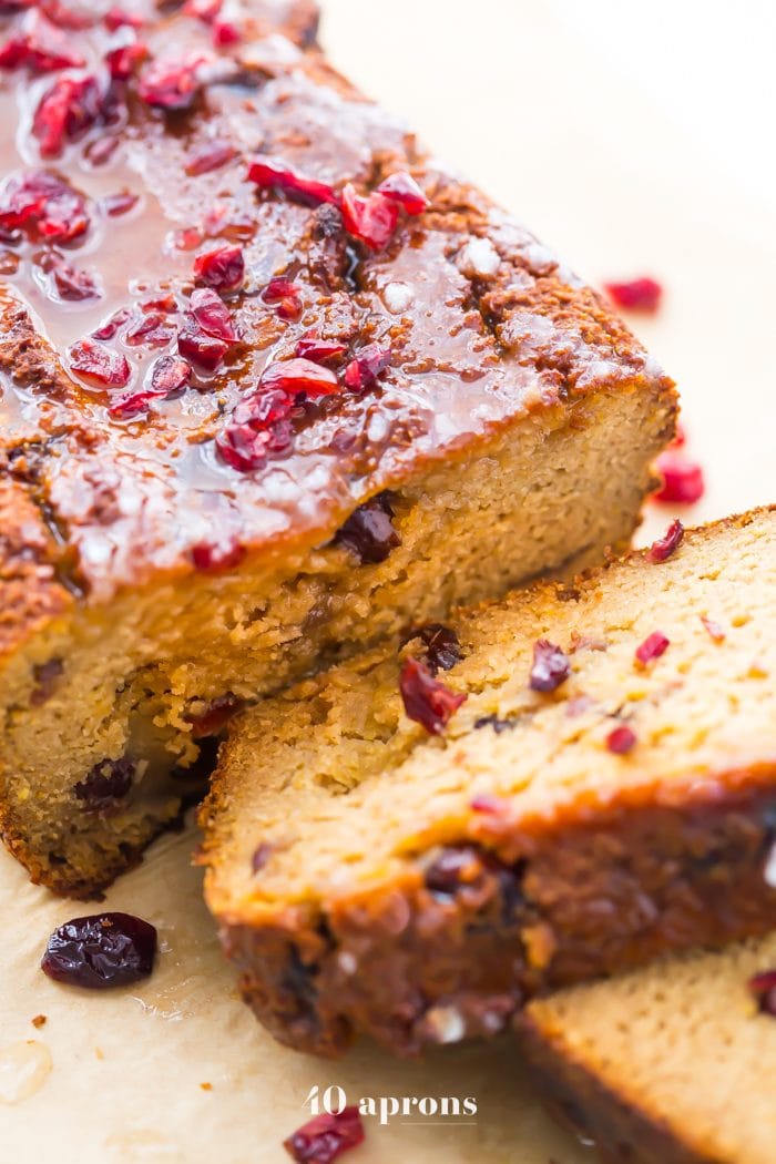 This paleo cranberry orange pound cake is such a wonderful paleo fall recipe! With fresh orange flavor and sweet-tart dried cranberries, this paleo cranberry orange pound cake is tender, moist, and full of flavor. This paleo cranberry orange pound cake takes full advantage of such a fantastic flavor combo and uses all healthier ingredients to make a lovely paleo fall recipe! Plus, details on how to put together the best pregnancy care package (not for me!).